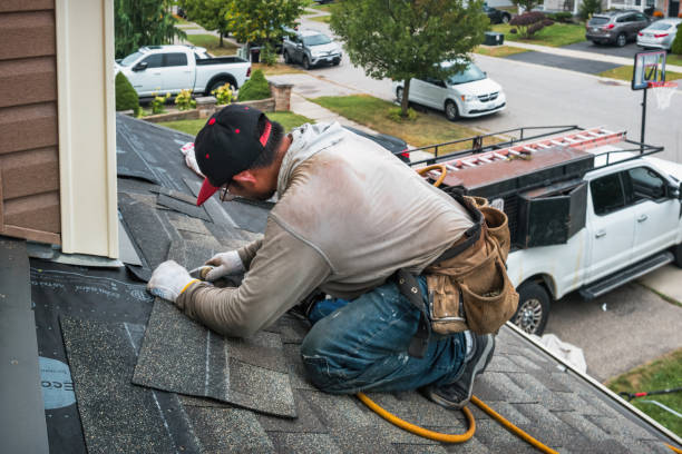 Professional Roofing technician working in Center Cross, VA